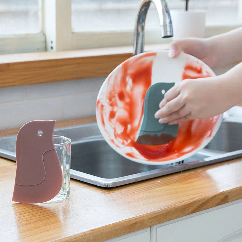 Penguin-shaped kitchen scraper for efficient plate and pot cleaning