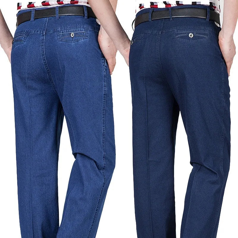Men's high-waist loose-fit blue denim jeans on a hanger, showing the zip fly and relaxed leg cut.