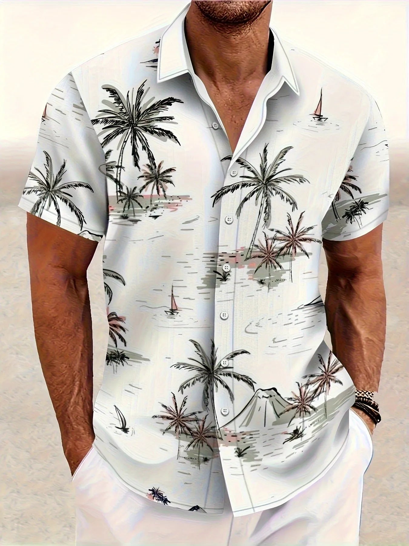 Man wearing a loose grey short sleeve shirt with a raised white 3D flower print pattern.