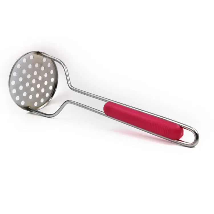 Manual potato masher with wooden handle and flower-shaped iron plated press head on a light surface
