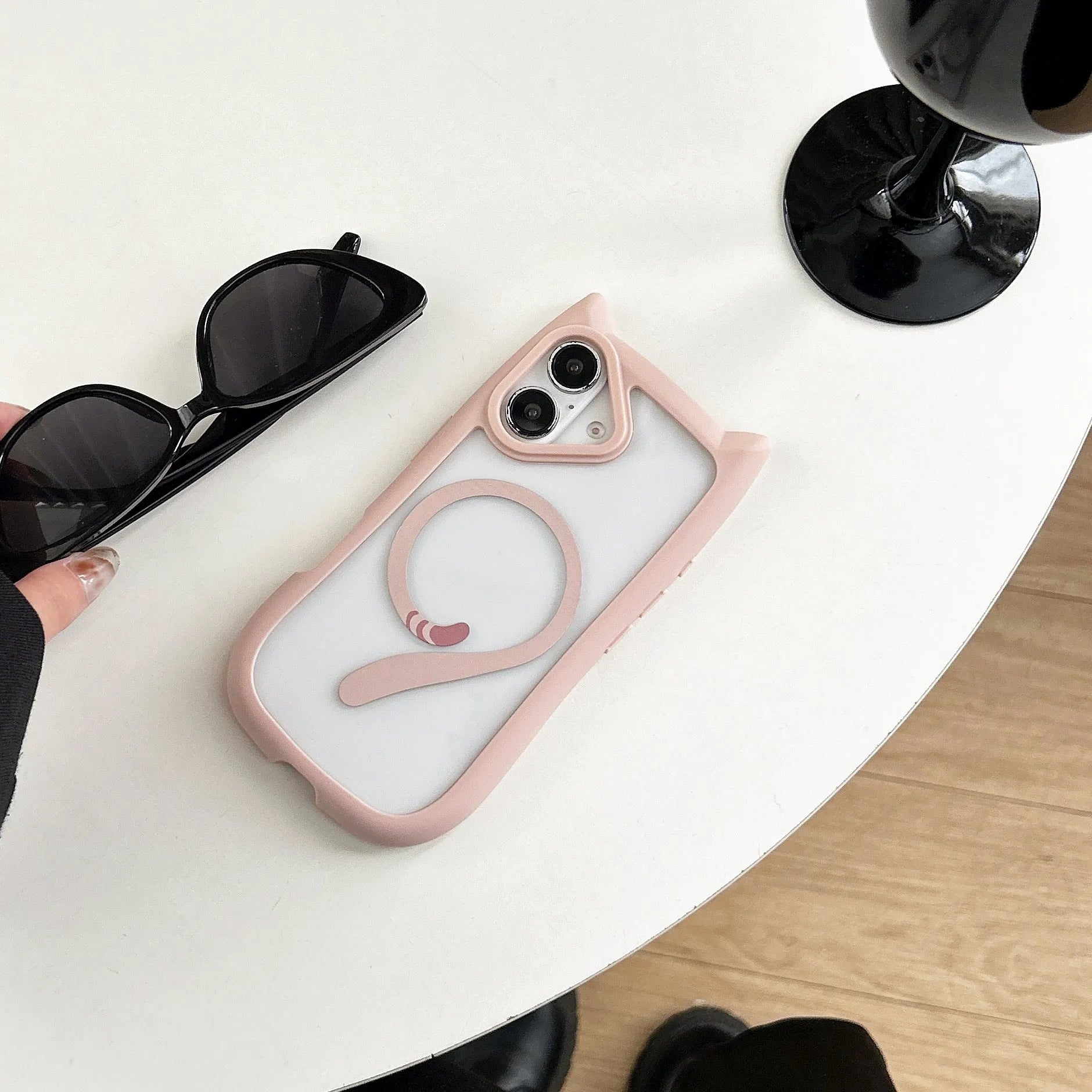 Transparent acrylic and black TPU phone case for iPhone 17 with a removable airbag component.