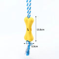 Green knotted rope bone dog toy with porous texture for holding beef strips and cheese treats