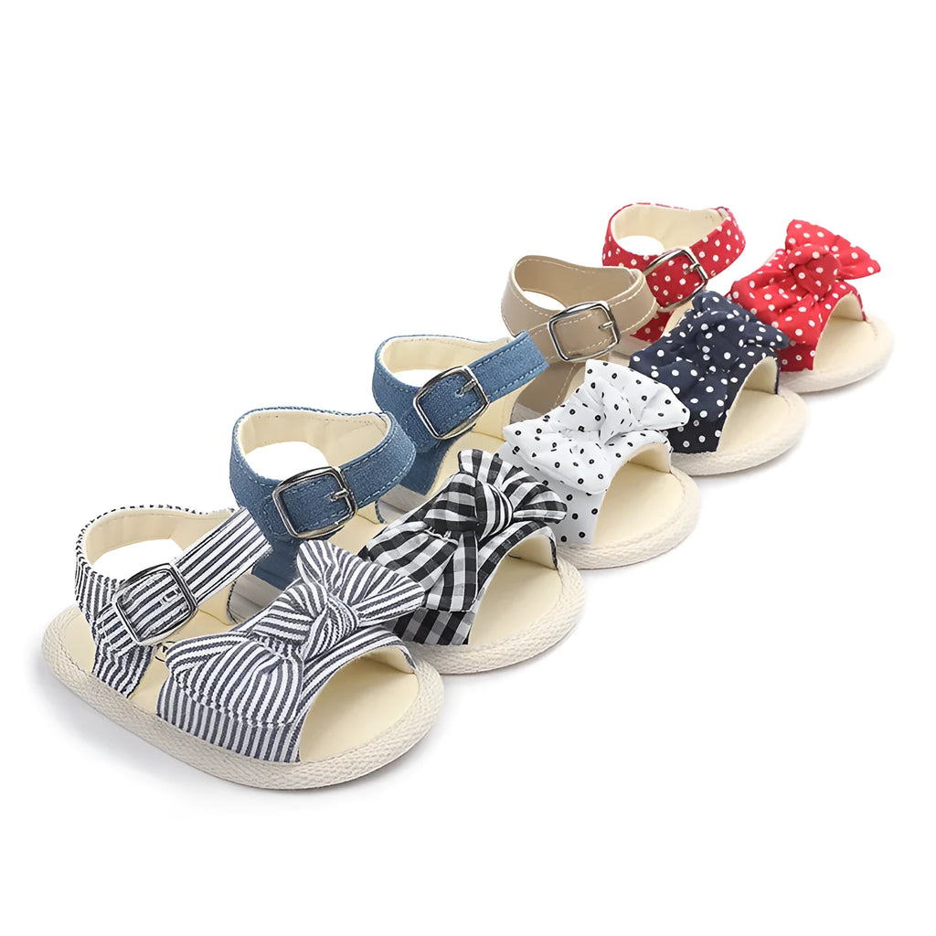 Black and white Velcro toddler shoes with low tube height design for babies 0-18 months