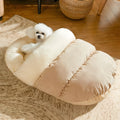 Slipper-shaped pet bed for cats and dogs with corduroy exterior and self-warming material