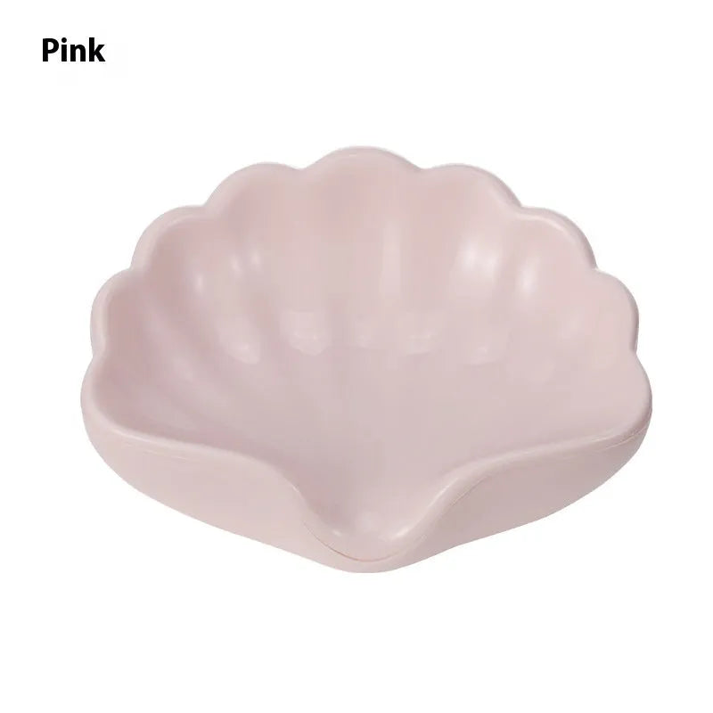 Shell-shaped plastic soap dish in pearl white or cherry blossom pink for bathroom use