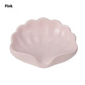 Shell-shaped plastic soap dish in pearl white or cherry blossom pink for bathroom use