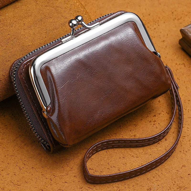 Ladies' small black buckle coin purse with a clip closure, shown closed, measuring 4 inches.