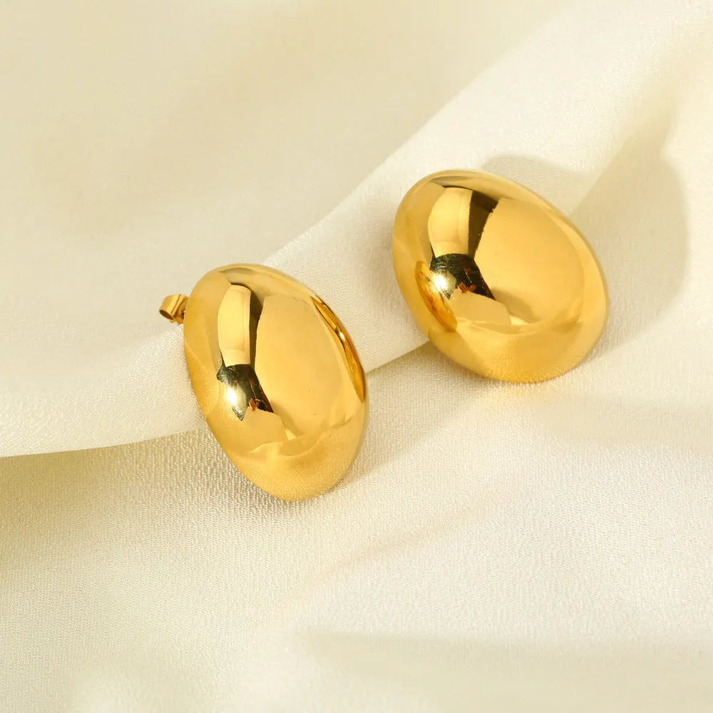 Geometric line design ear studs with stainless steel and 18K plating showing exaggerated glazed surface