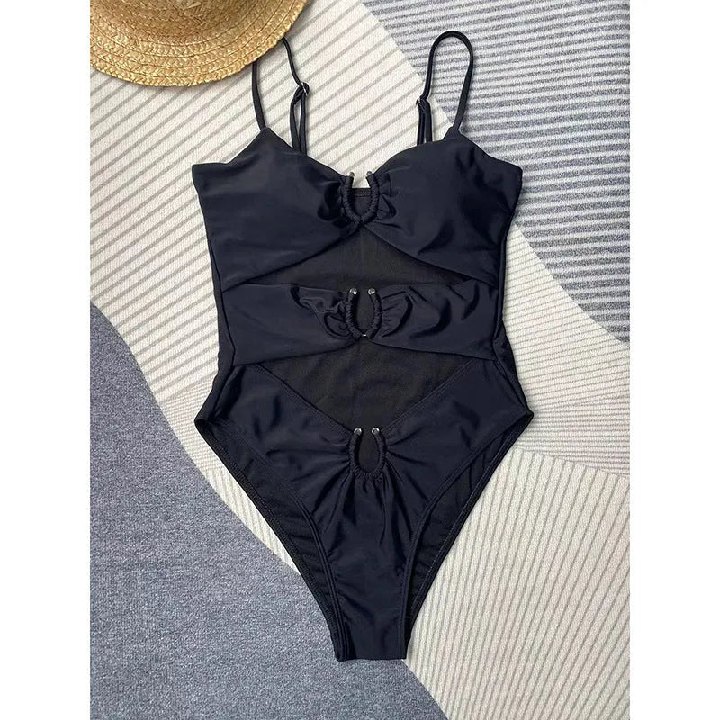 Women's black solid colour one-piece swimsuit with bikini style and tight fit