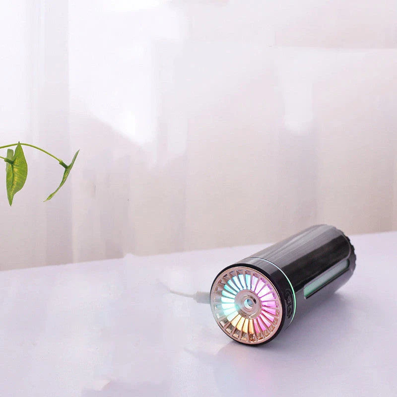 Portable ultrasonic humidifier with colorful lights, USB charging, and compact design for use in car or home