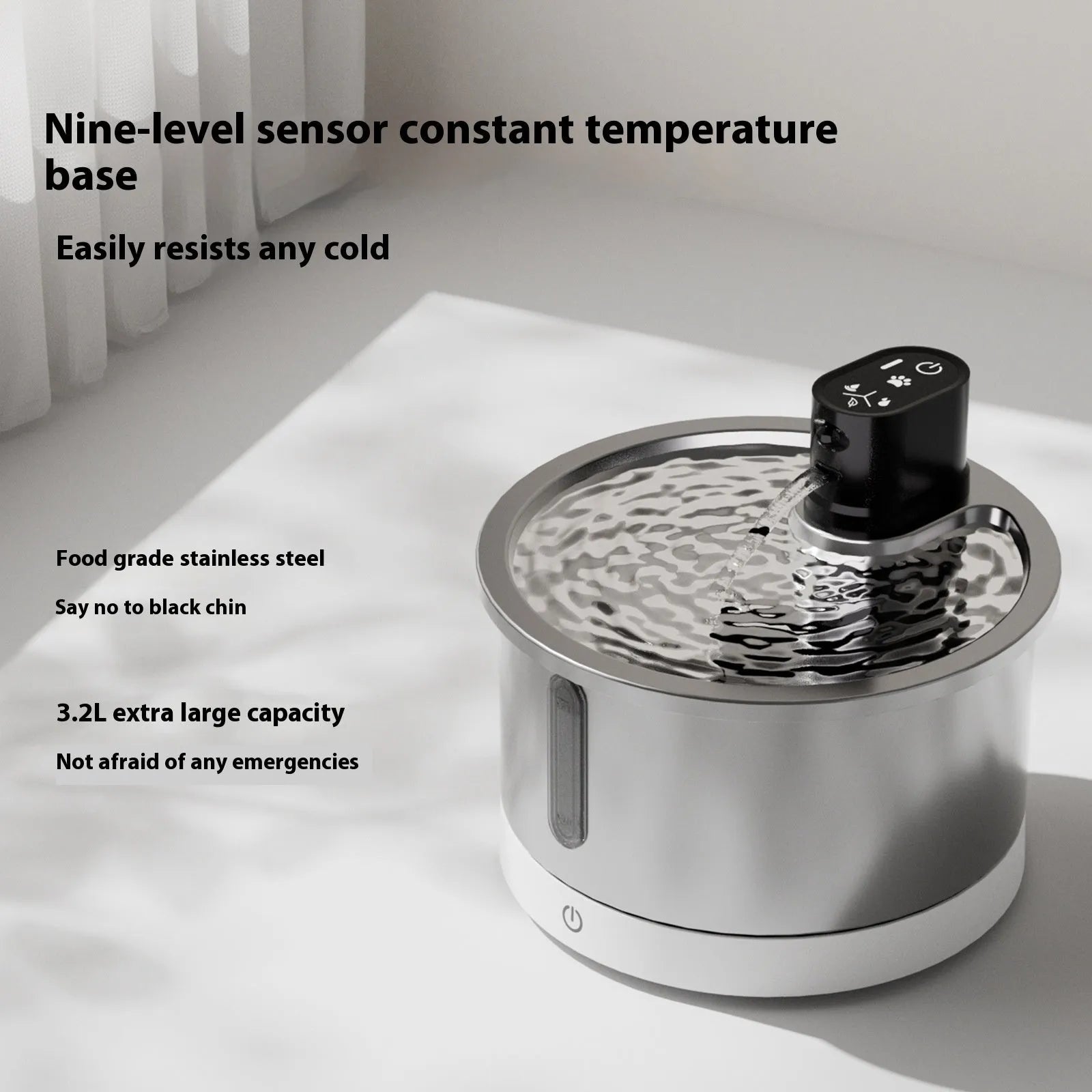 Stainless steel heated pet water fountain on a white base with a charging cable.