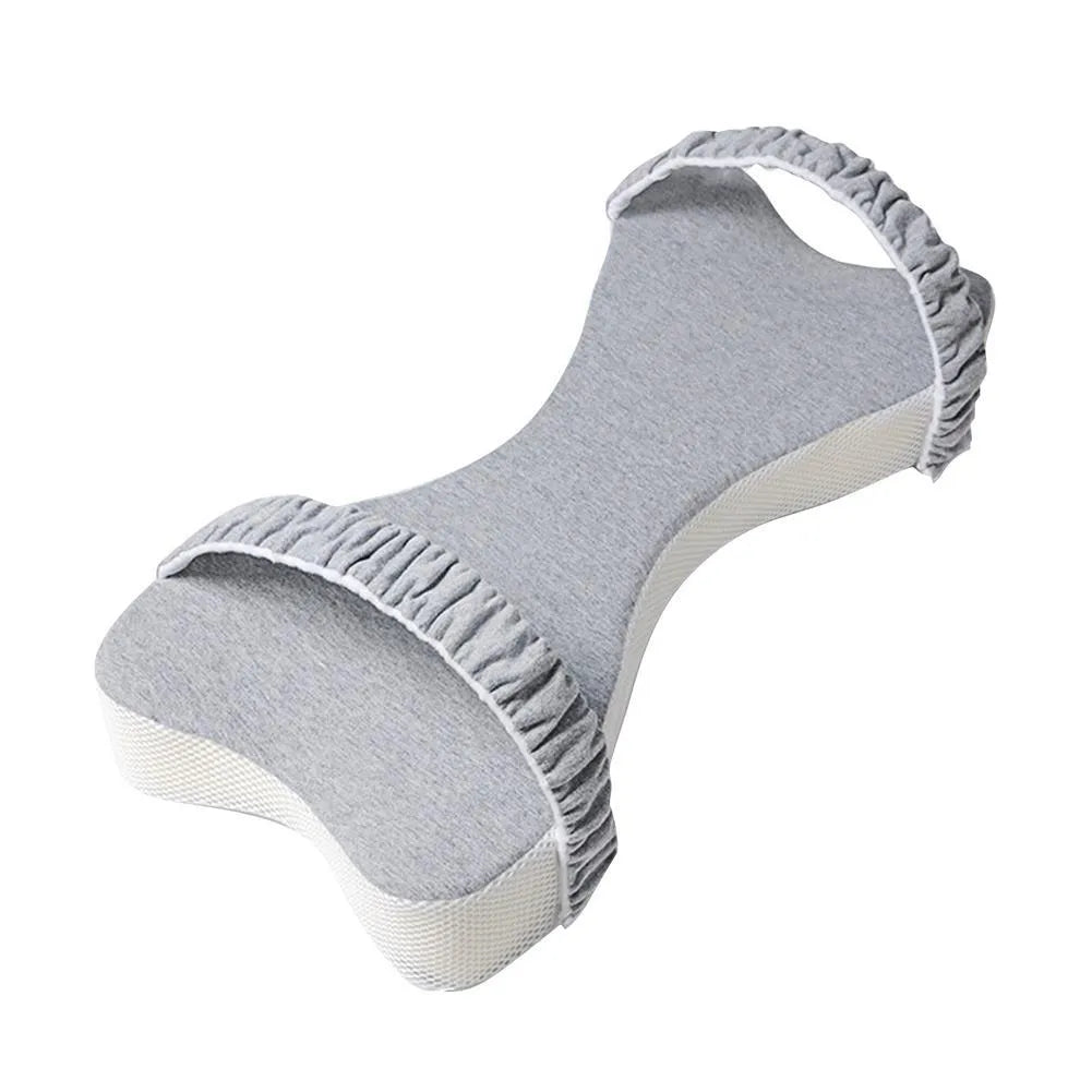 Memory cotton knee pillow in light blue on a bed, size 70x37x9cm for side sleeping support