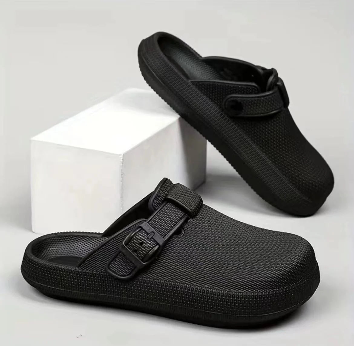 Lightweight EVA indoor home slippers in black, gray, and white