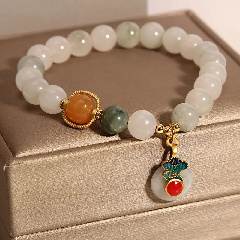 Women's ice jade bracelet with pearl accents and traditional jade buckle