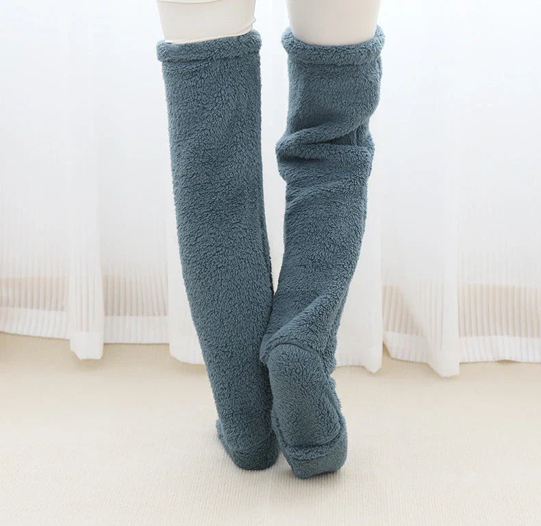 Cozy over-the-knee fuzzy socks in various colors, designed to keep your legs and knees warm during the winter season.