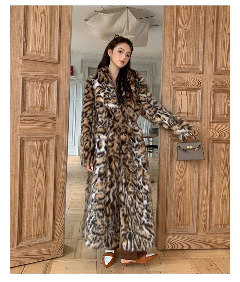 Faux fur street fashion coat with fur collar in long style with regular sleeves and pockets