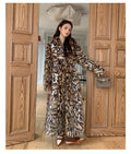 Faux fur street fashion coat with fur collar in long style with regular sleeves and pockets