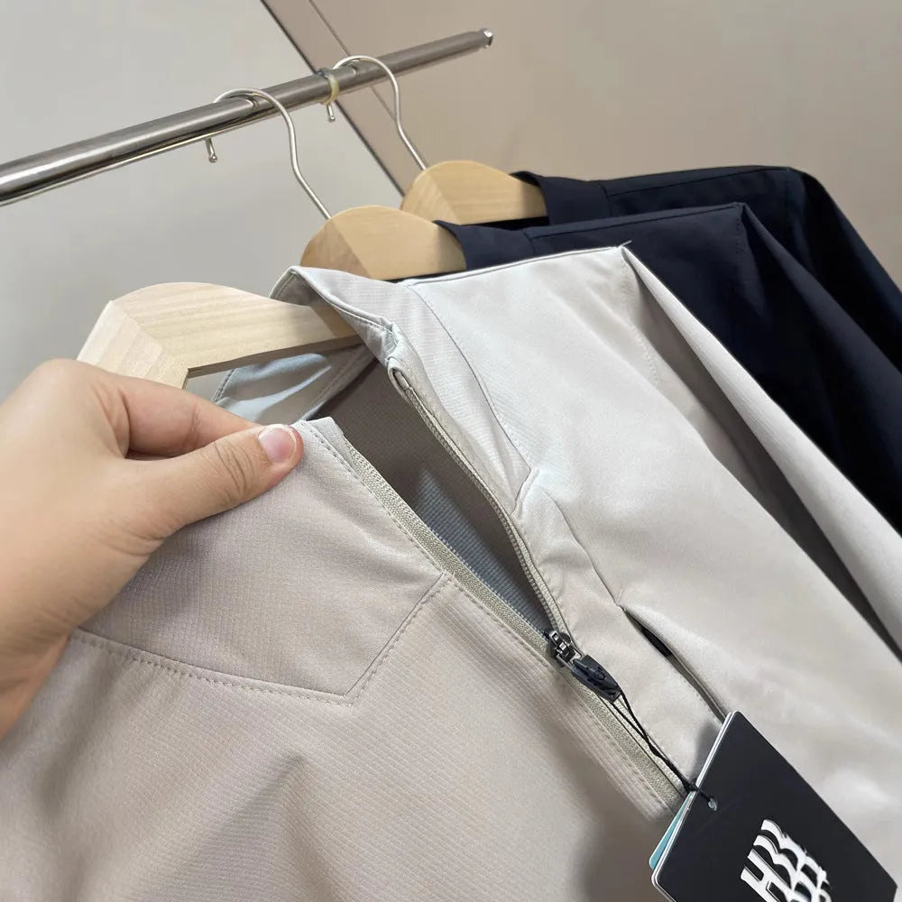Men's black stand collar casual jacket with long sleeves and a straight hem.