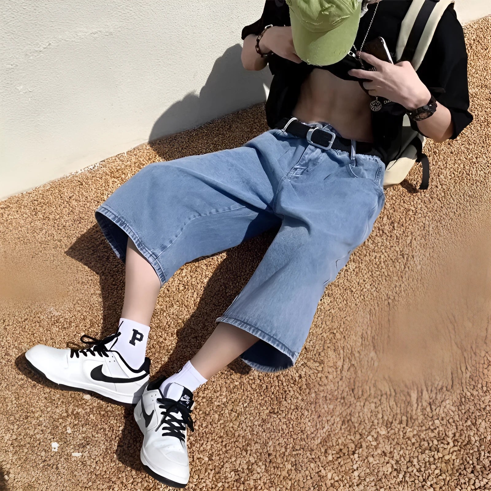Blue high-waisted men's denim pirate shorts with a cropped length and straight-leg silhouette on a white background.