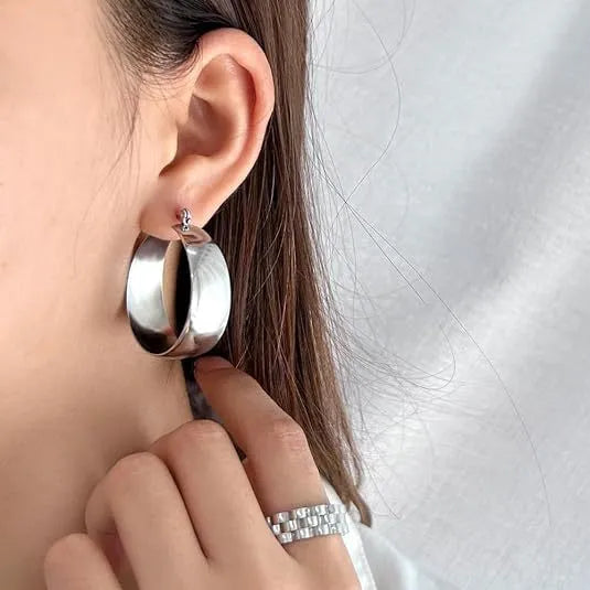 Widened curved stainless steel earrings in steel or gold colour, 25mm or 30mm size