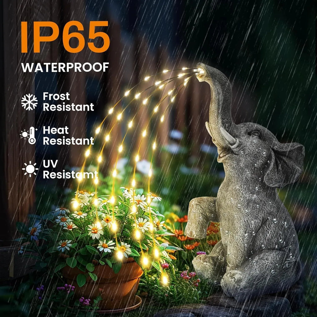 Resin elephant outdoor garden statue with built-in LED lighting strip.