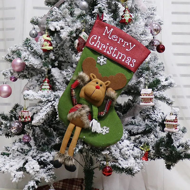 Three large Christmas stockings with Santa, Snowman, and Reindeer 3D applique designs hanging from a mantel