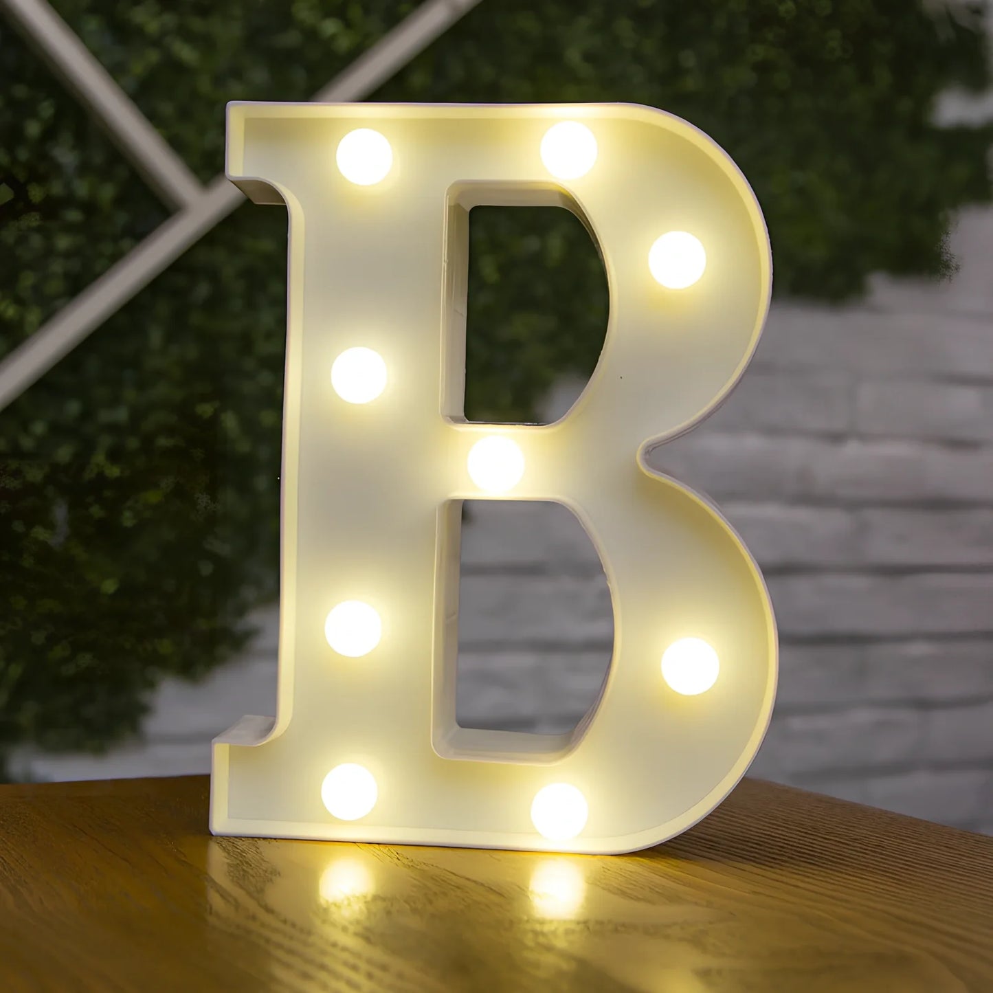 White plastic LED alphabet marquee sign with warm white illumination, 22cm height with battery operation