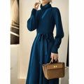 Women's turtleneck knit dress in rose red with long sleeves, loose hem, and elastic waist.