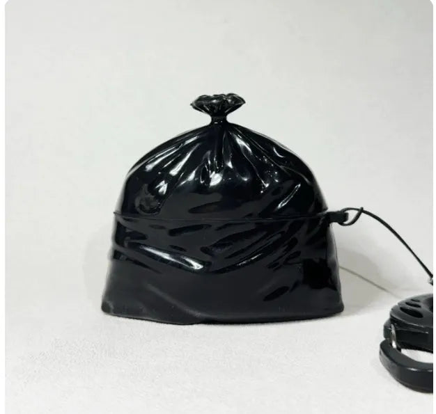 Black silicone trash bag earphone case on a white background, universal soft shell design
