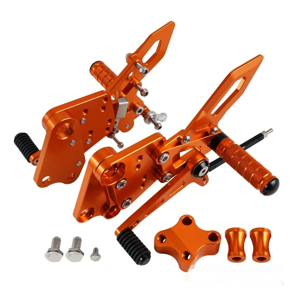 KTM DUKE motorcycle raised footrest relocation kit in black and orange colours