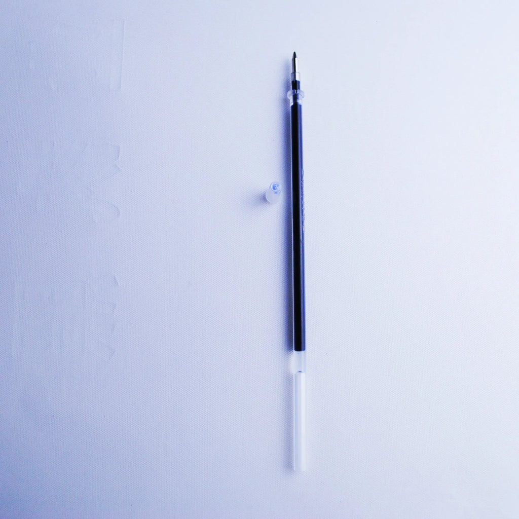 Automatic fading pen set showing blue refills, a plastic pen, and a storage holder.