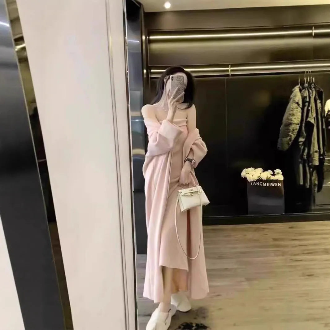 Women's grey knitted cardigan dress suit set with long skirt and flocking detail.