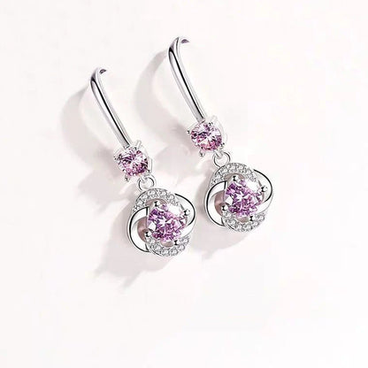 Silver four-leaf clover stud earrings with fairy hooks, symbolising happiness