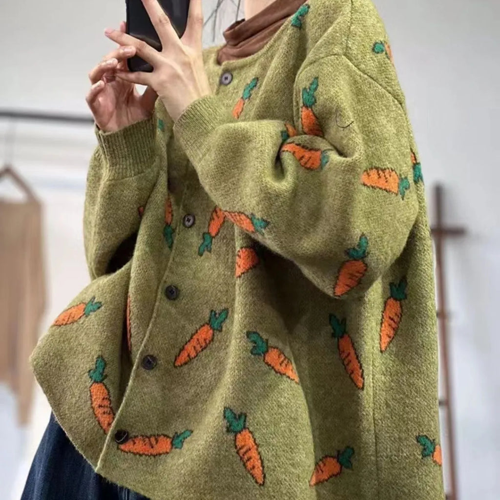 Loose grey cardigan with artistic multi-colour print, round neck, and regular sleeves.
