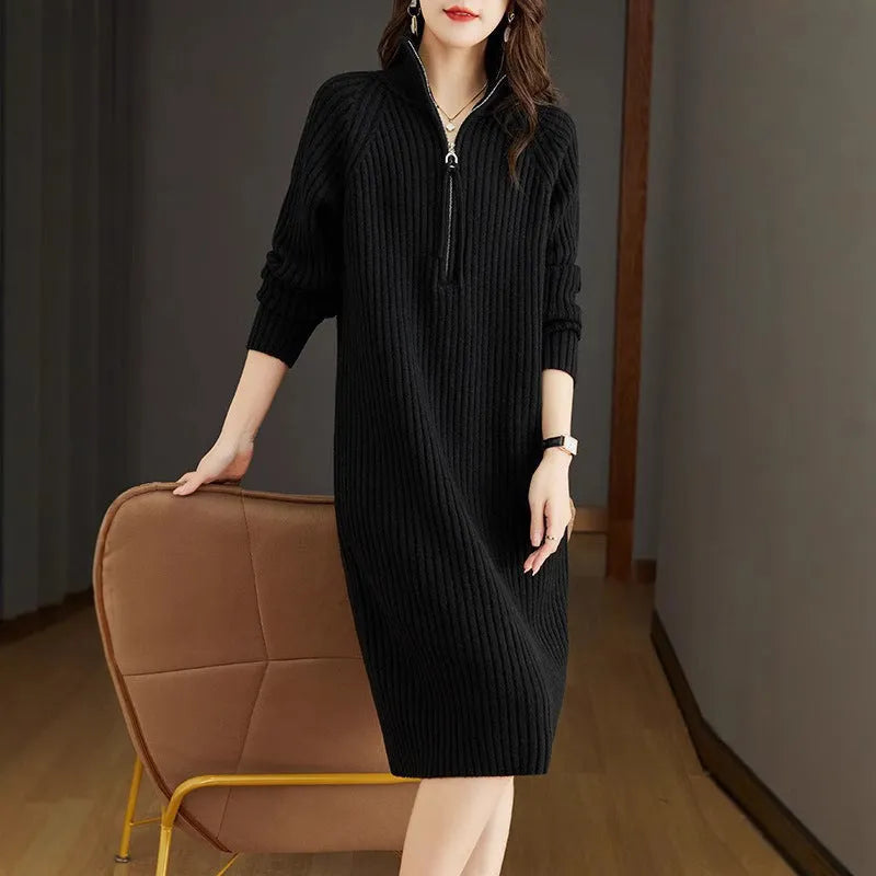 Beige half zip straight skirt with long sleeves and a stand collar, shown on a model.