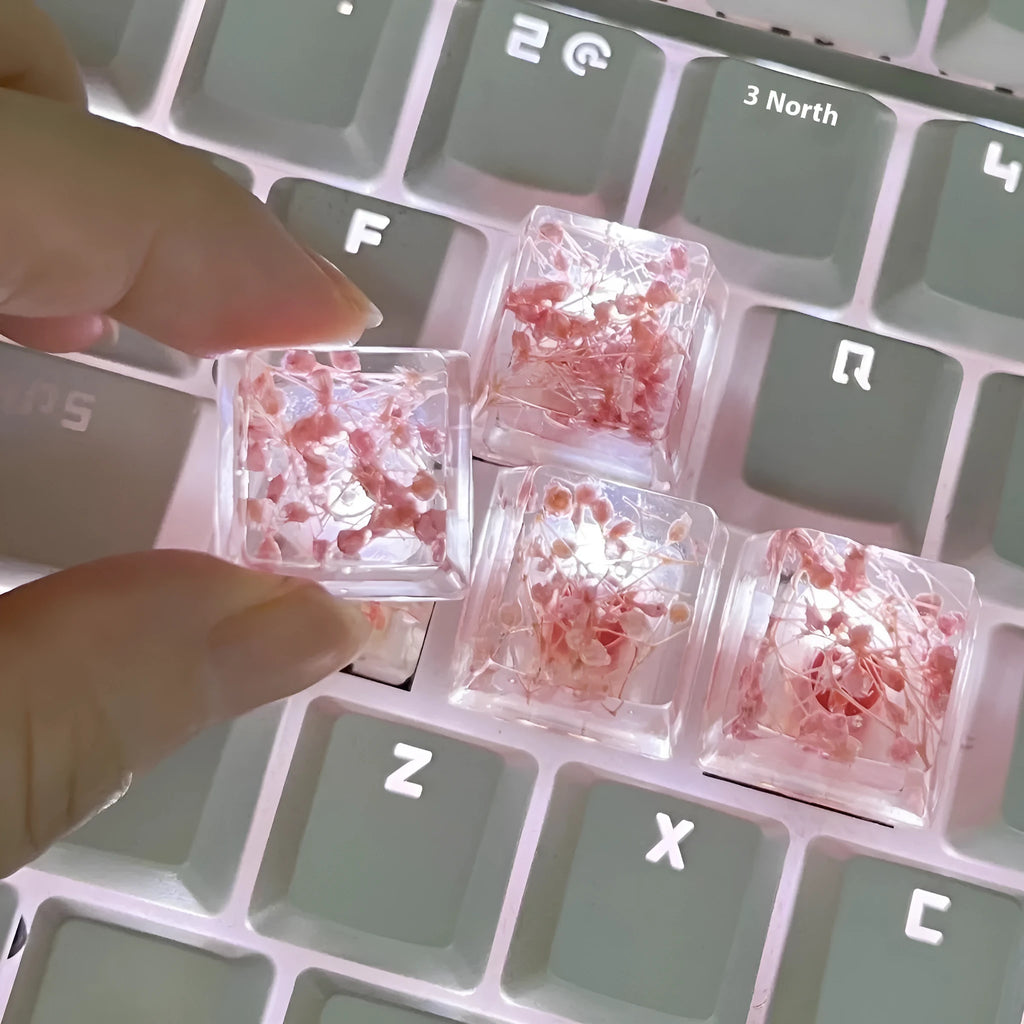 High transparency resin starry sky keycap for mechanical keyboard in green, pink, red, and violet colours.