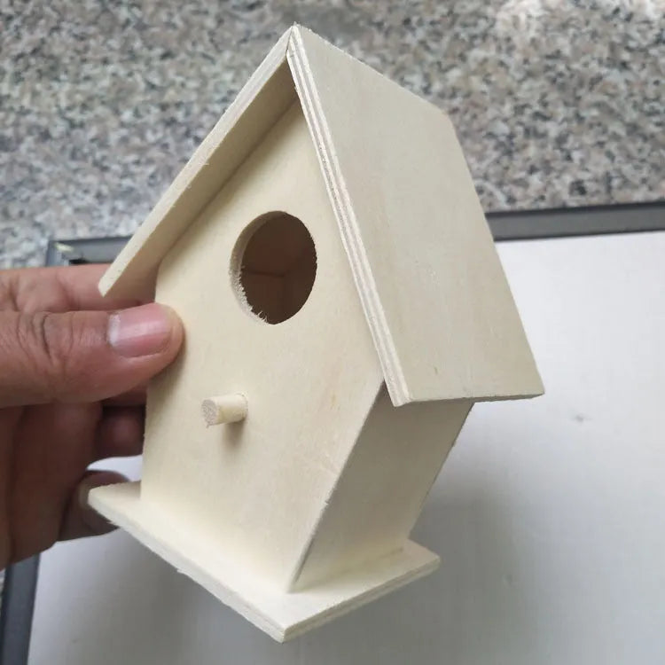 Set of six polished wooden bird nest ornaments in pine and poplar, including heart, double hole, and lace eave styles.