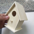 Set of six polished wooden bird nest ornaments in pine and poplar, including heart, double hole, and lace eave styles.