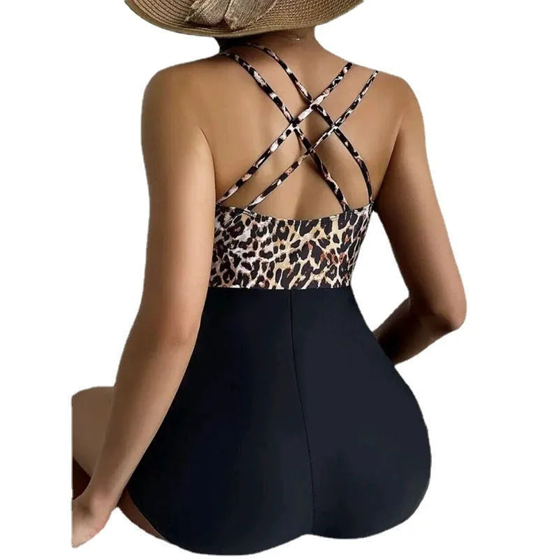 Women's one-piece leopard print crossover lace up slimming hip swimsuit in black and white leopard print