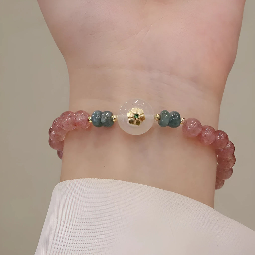 Women's strawberry quartz bracelet with blue water emerald stones and round jade pendant on geometric chain