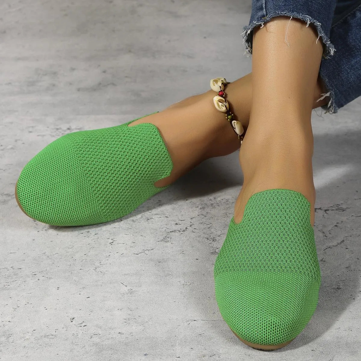 Apricot-coloured casual mesh slip-on sandals with a cloth upper and flat rubber sole.