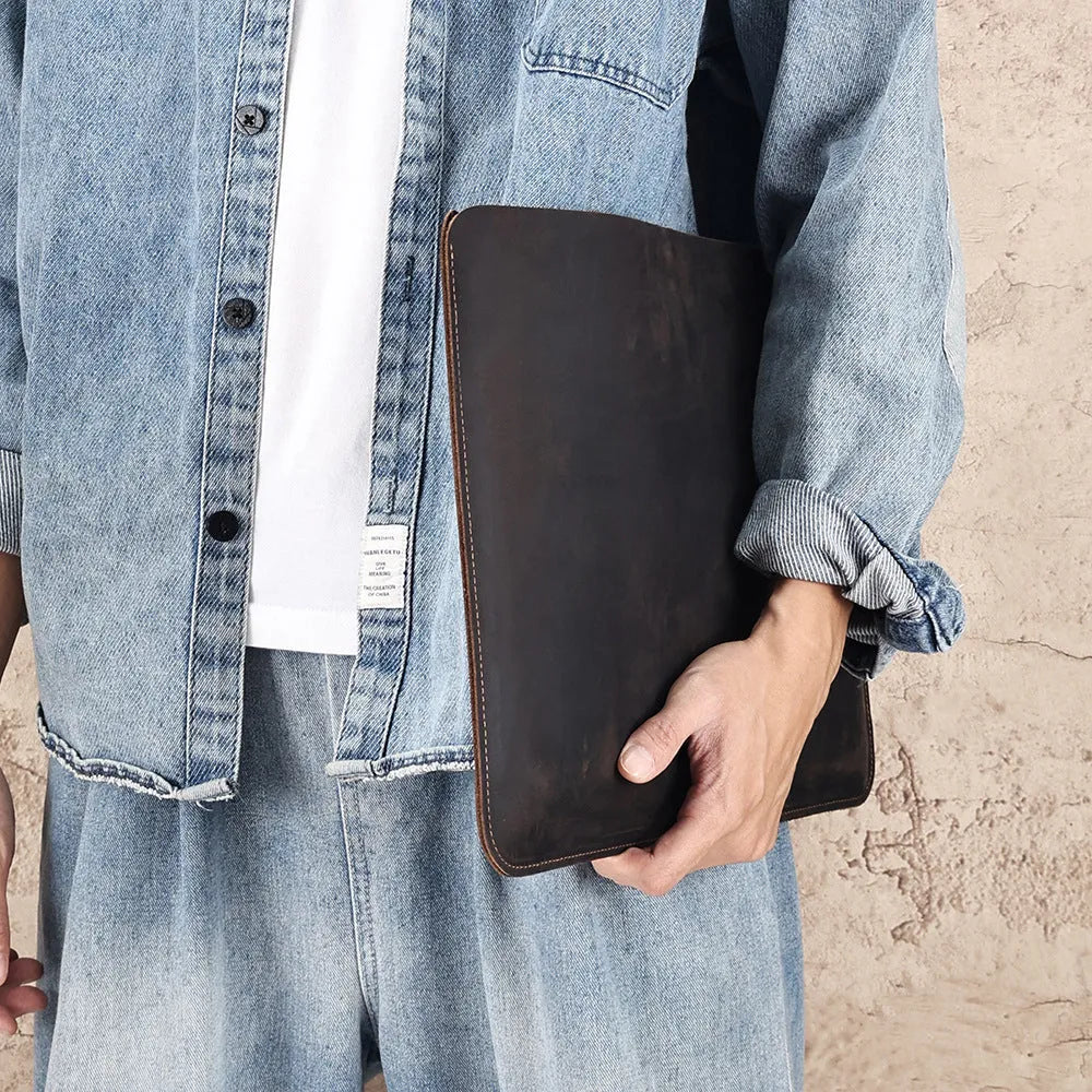 Genuine crazy horse leather horizontal computer liner bag showing medium brown colour and organisational compartments