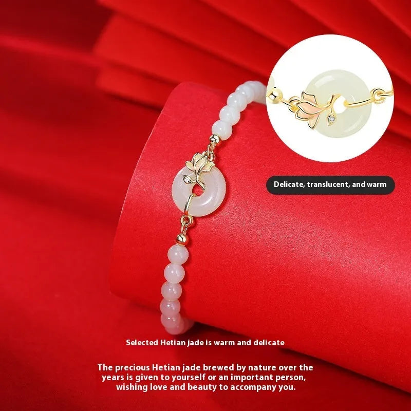 Orchid Hetian jade S925 sterling silver magnolia round beads bracelet on display