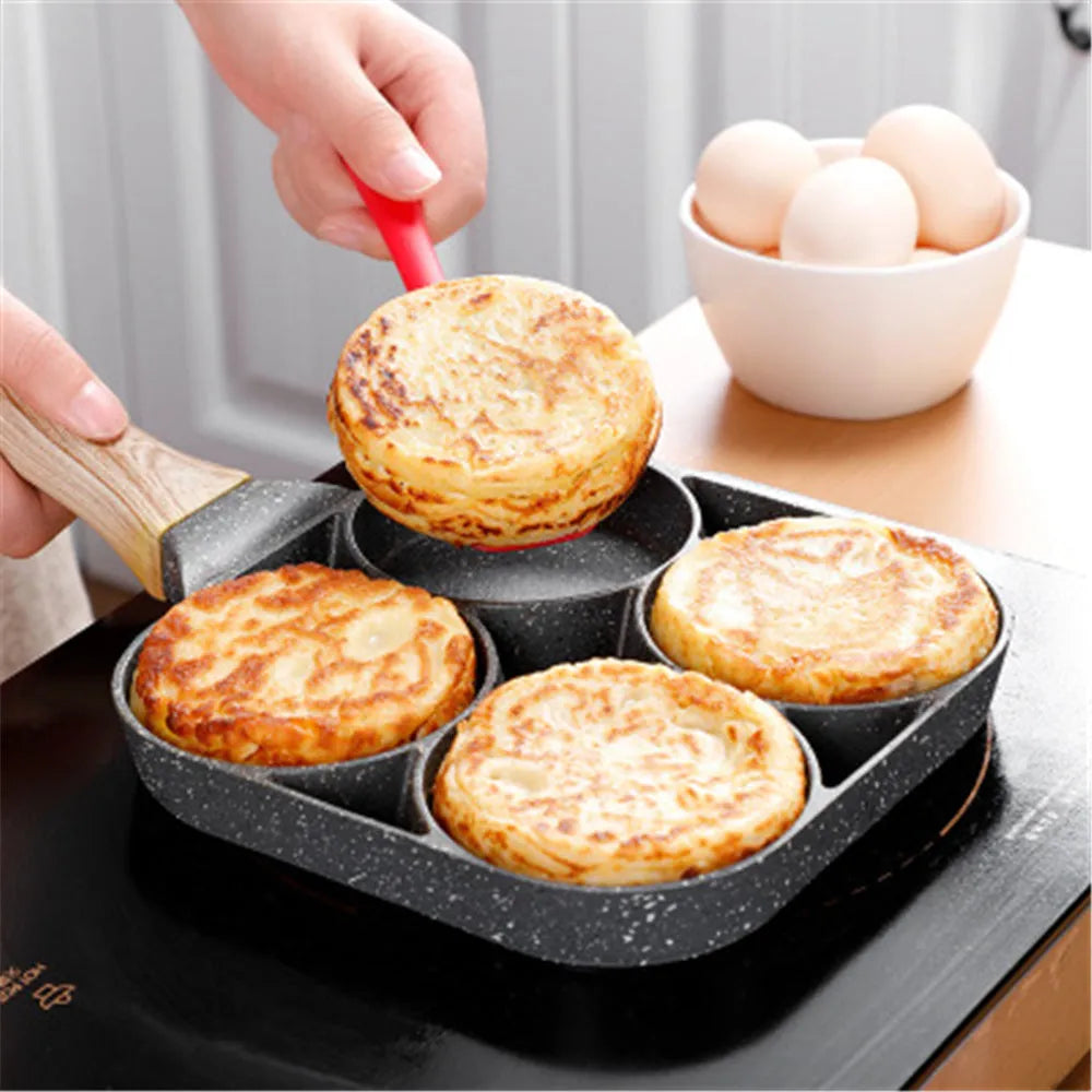 Four-hole non-stick frying pan with Bakelite handle for making eggs, burgers and pancakes.