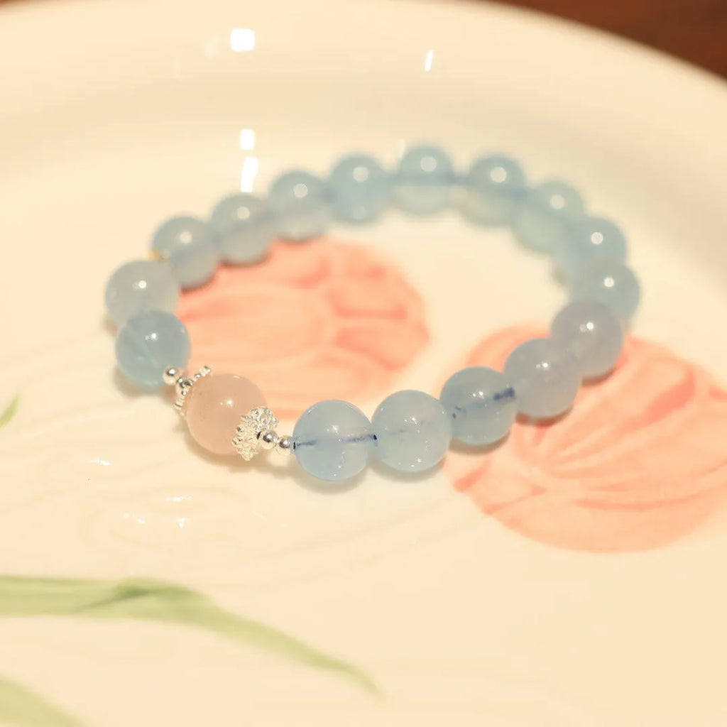 DIY aquamarine bracelet kit with Chinese Fengjiu fox design and pink crystals.