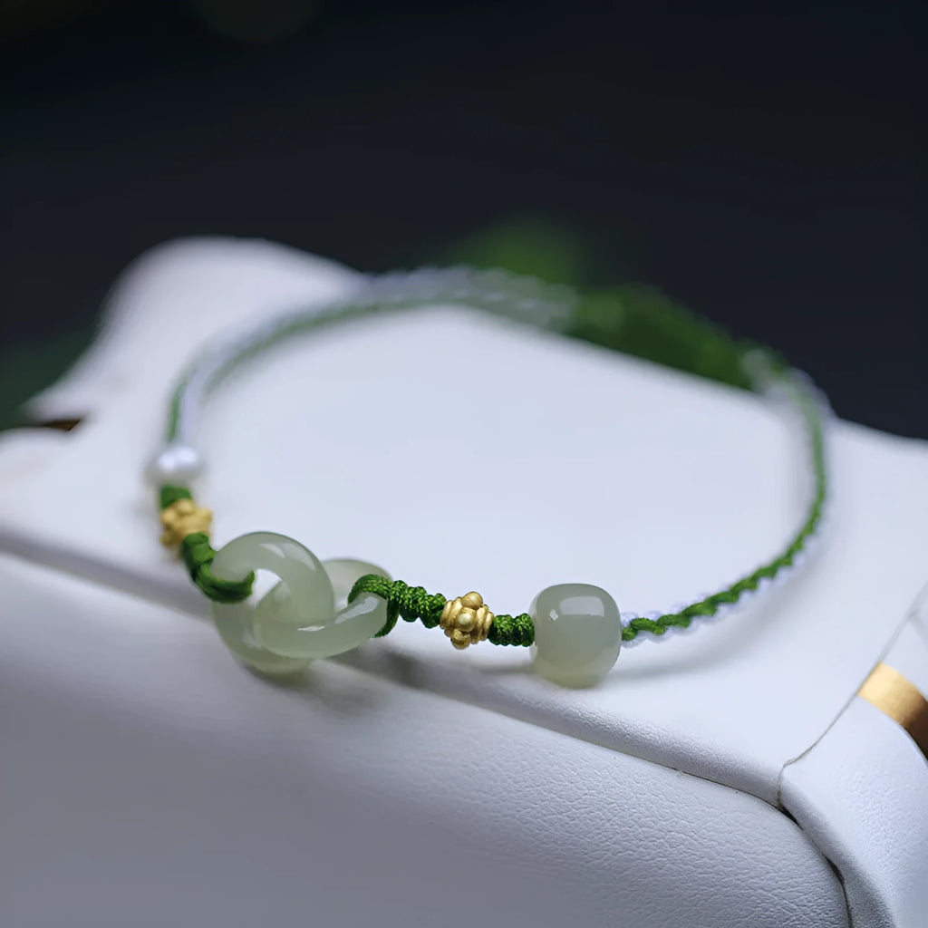 Natural Hetian jade woven bracelet with flexible wire construction and hollow out design