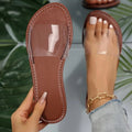 Women's flat transparent slippers in brown, Rose Red, and white made from artificial PU material