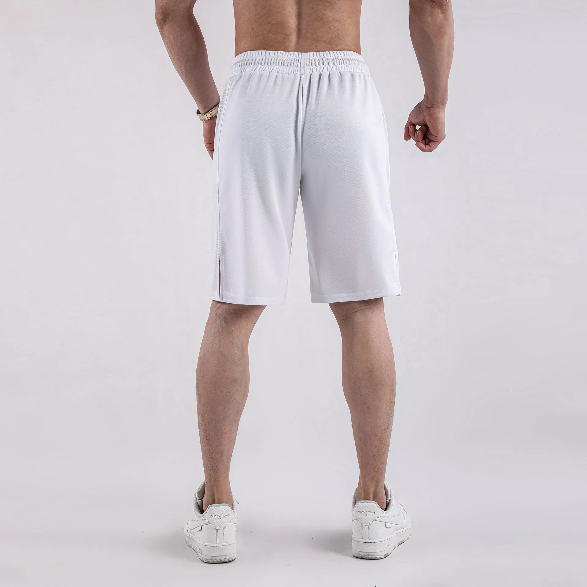 Men's black quick-drying mesh capri shorts with a loose fit and mid waist.