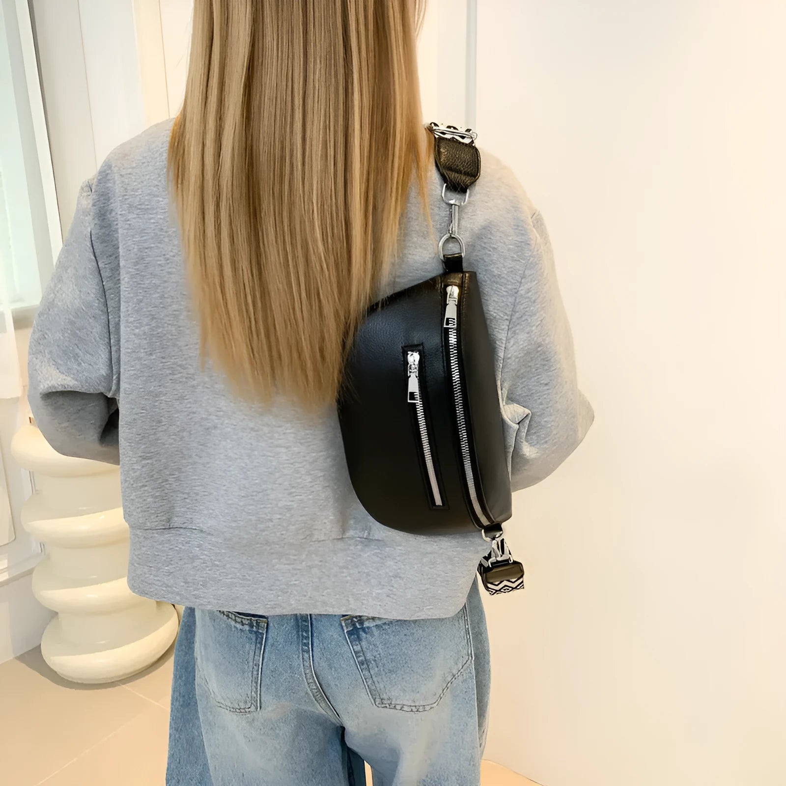 Soft PU crossbody bag in light gray, oval shape, with single shoulder strap and slit pocket