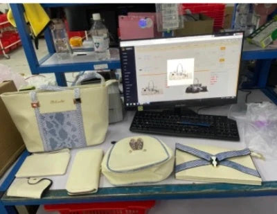 Elegant women's shoulder bag with zipper and organised pocket in light grey, black, off-white, and rose red